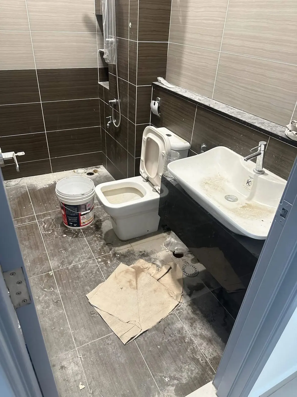 Bathroom before cleaning from an O&L post-renovation cleaning job